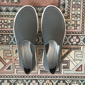 CROCS slip-on shoes.